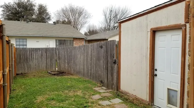 a pathway of a house with wooden floor