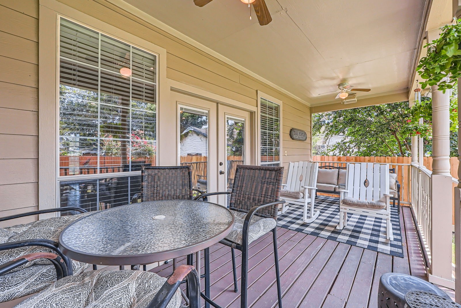 806 East 29th Street Houston, TX 77009 - Photo 4 of 30 Charming covered porch featuring ceiling fans, perfect for relaxing or entertaining.