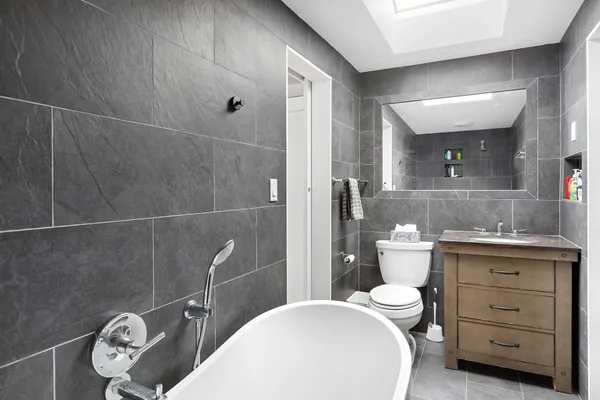 a bathroom with a sink toilet and shower