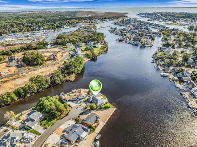 an aerial view of a house with a swimming pool