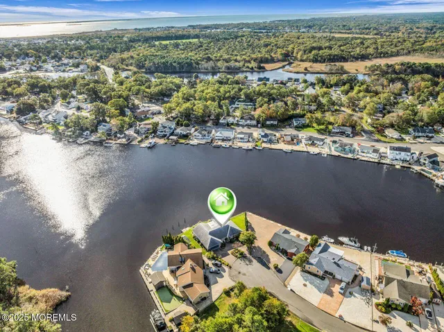 an aerial view of a house with yard swimming pool and outdoor seating