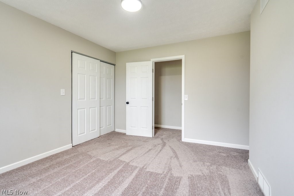 4596 Hattrick Road Rootstown, OH 44272 - Photo 33 of 45 Unfurnished bedroom featuring light colored carpet