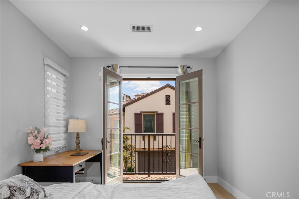 107 Tritone Irvine, CA 92602 - Photo 4 of 15 a bedroom with furniture and a window