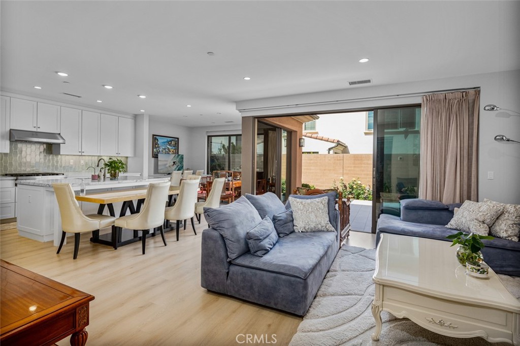 107 Tritone Irvine, CA 92602 - Photo 7 of 15 a living room with furniture and a large window