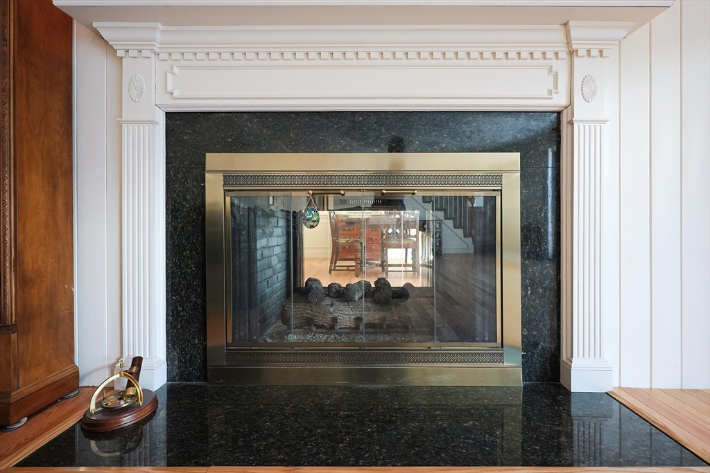 93 Potter Pond, Unit 93 Lexington, MA 02421 - Photo 11 of 42 a closeup of a fireplace with a bench