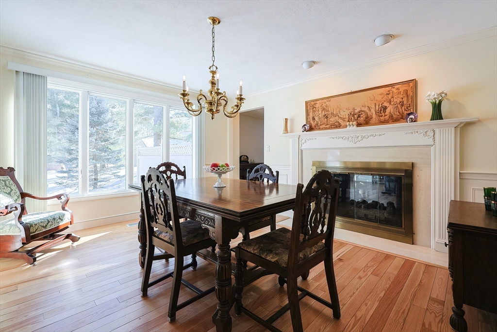 93 Potter Pond, Unit 93 Lexington, MA 02421 - Photo 12 of 42 a view of a dining room with furniture window and wooden floor