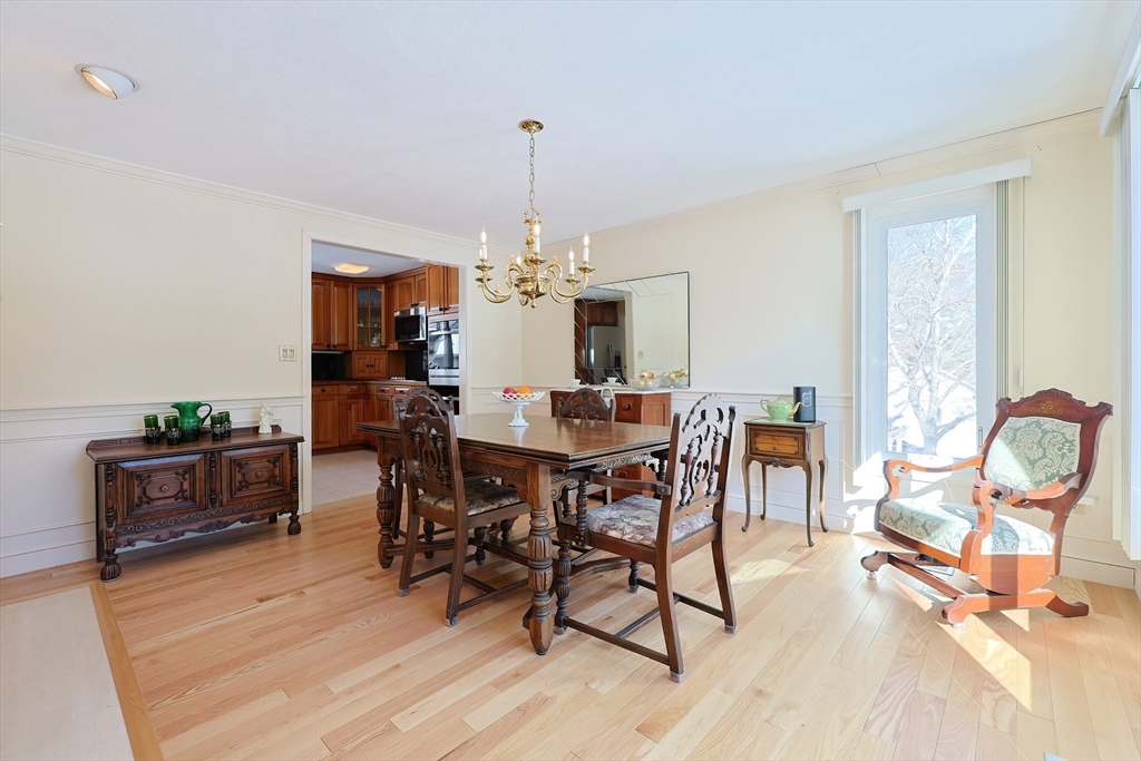 93 Potter Pond, Unit 93 Lexington, MA 02421 - Photo 14 of 42 a view of a dining room with furniture window and wooden floor