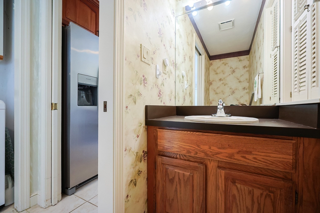 93 Potter Pond, Unit 93 Lexington, MA 02421 - Photo 20 of 42 a close view of a sink and mirror