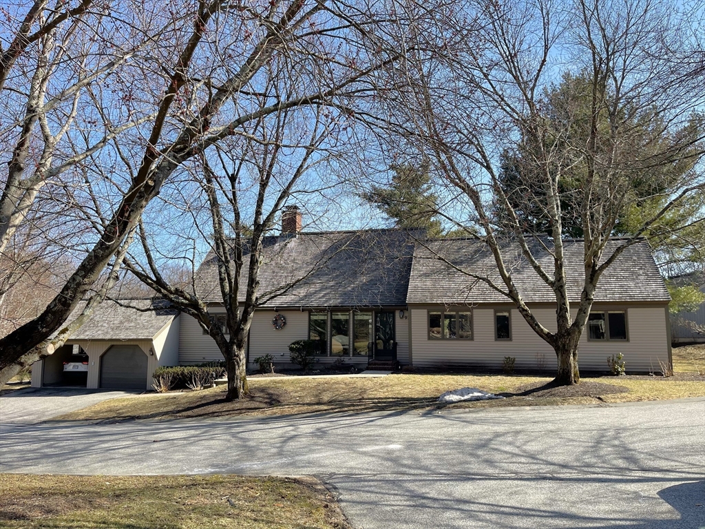 93 Potter Pond, Unit 93 Lexington, MA 02421 - Photo 2 of 42 a view of a yard in front of house
