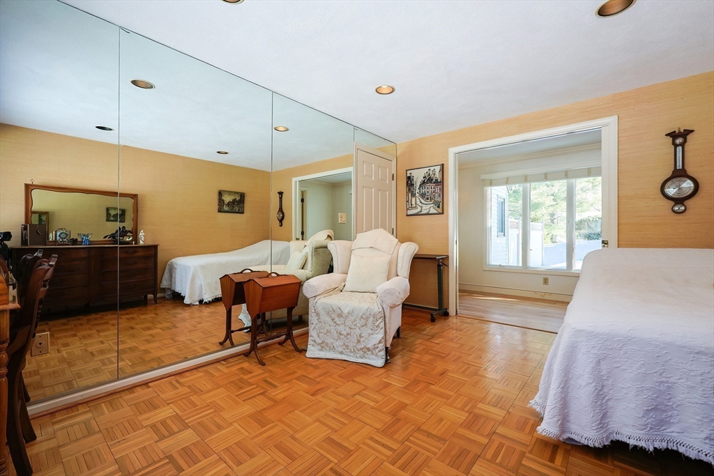 93 Potter Pond, Unit 93 Lexington, MA 02421 - Photo 29 of 42 a living room with furniture and a flat screen tv