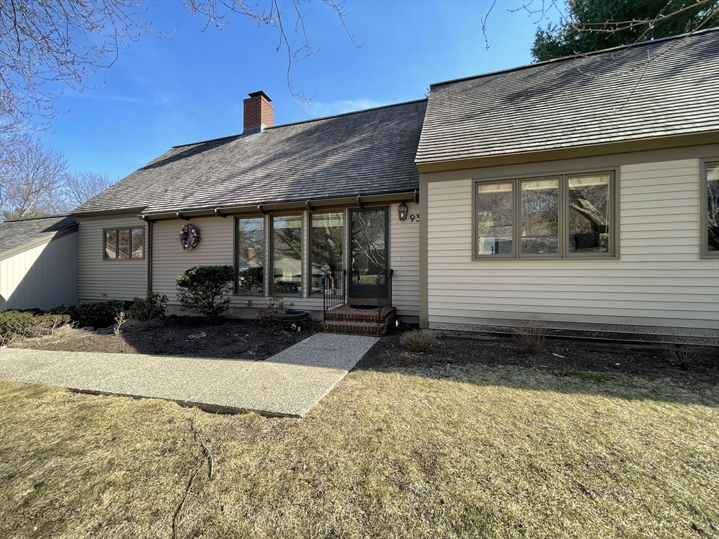 93 Potter Pond, Unit 93 Lexington, MA 02421 - Photo 3 of 42 a front view of a house with a yard