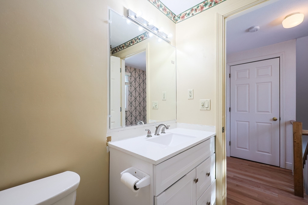93 Potter Pond, Unit 93 Lexington, MA 02421 - Photo 35 of 42 a bathroom with a sink toilet and shower