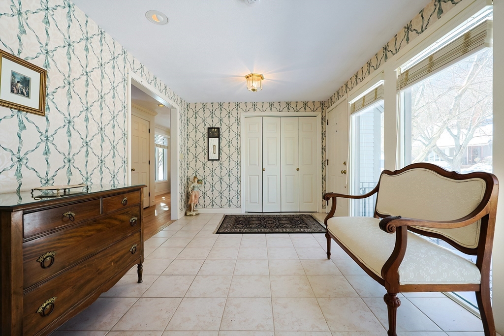 93 Potter Pond, Unit 93 Lexington, MA 02421 - Photo 6 of 42 a spacious bathroom with a granite countertop sink a mirror a vanity and a shower