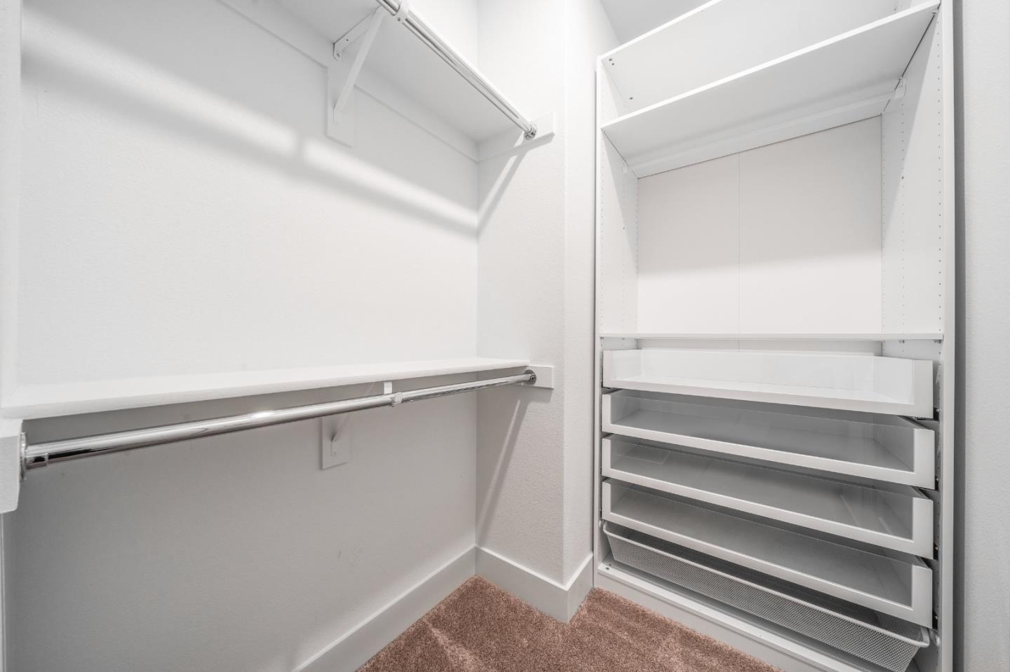 8553 Seawind Way Newark, CA 94560 - Photo 20 of 30 a view of walk in closet with empty racks