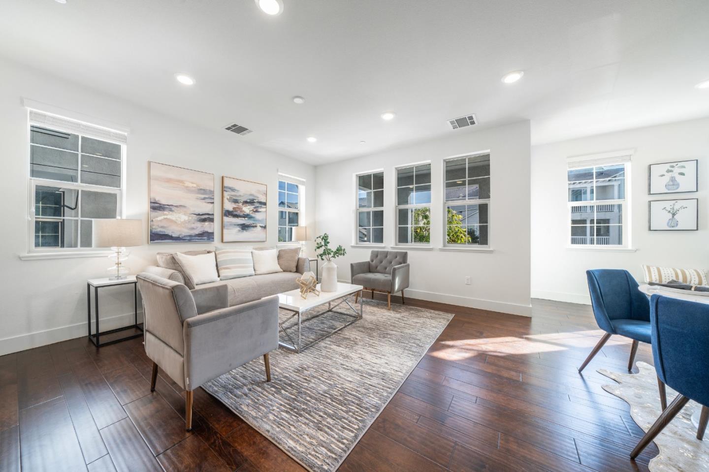 8553 Seawind Way Newark, CA 94560 - Photo 8 of 30 a living room with furniture and wooden floor