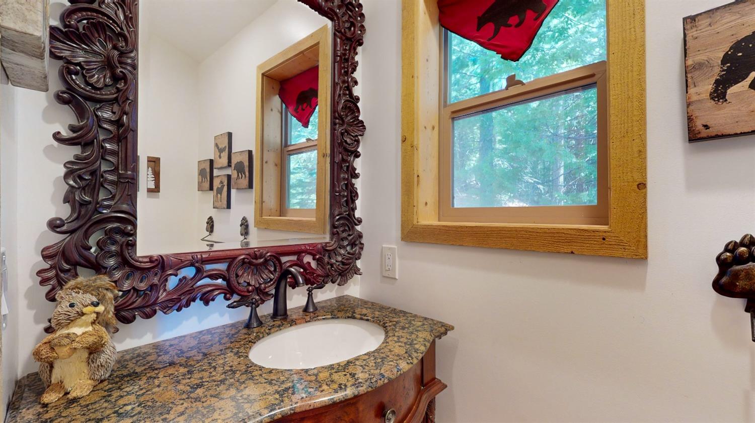 10671 Lowell Hill Road Nevada City, CA 95959 - Photo 15 of 35 a bathroom with a granite countertop sink and a mirror