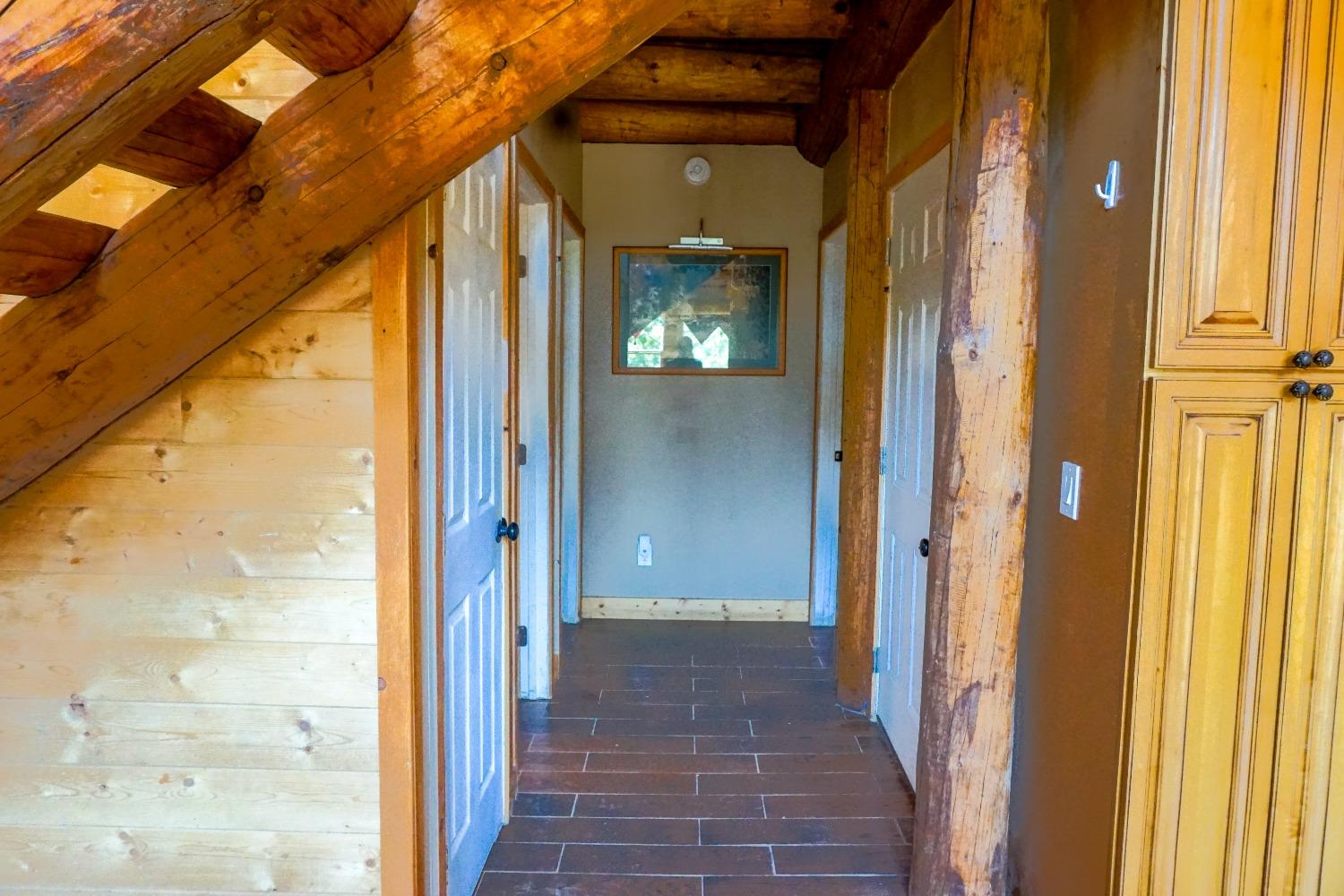 10671 Lowell Hill Road Nevada City, CA 95959 - Photo 17 of 35 a view of a hallway with wooden shelves