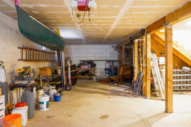 a view of a garage with a bike and car