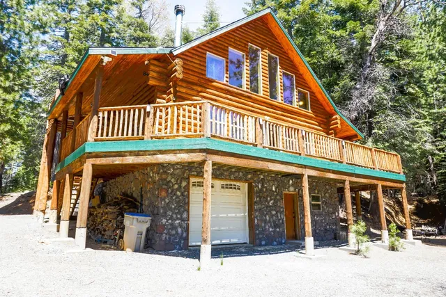 a view of balcony with wooden floor and fence