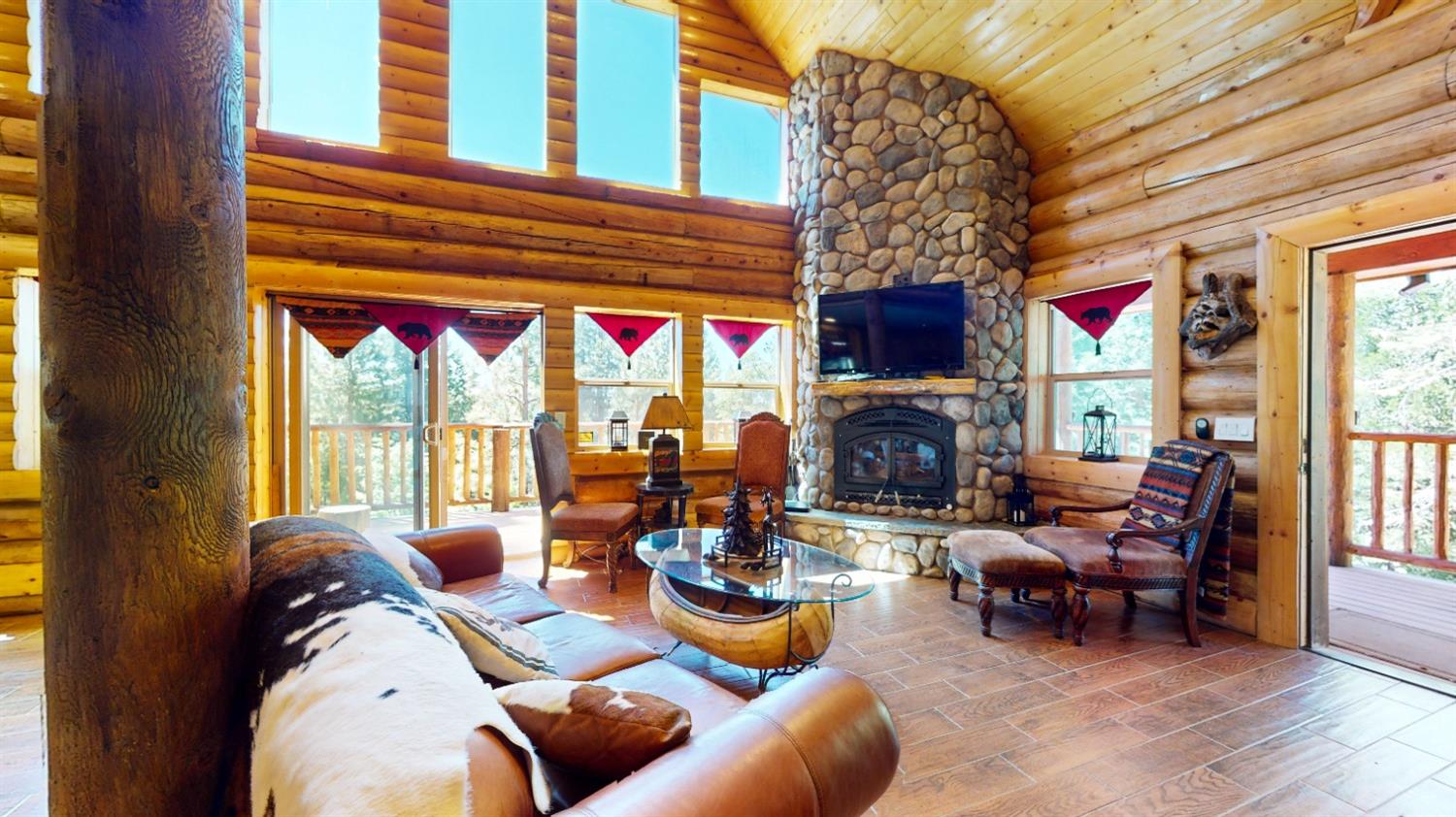 10671 Lowell Hill Road Nevada City, CA 95959 - Photo 4 of 35 a living room with fireplace furniture and a large window