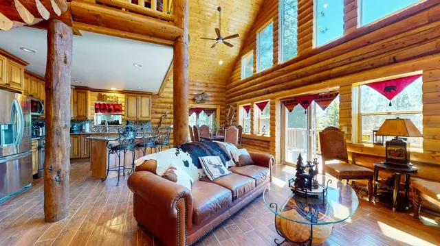 a view of a patio with dining table and chairs