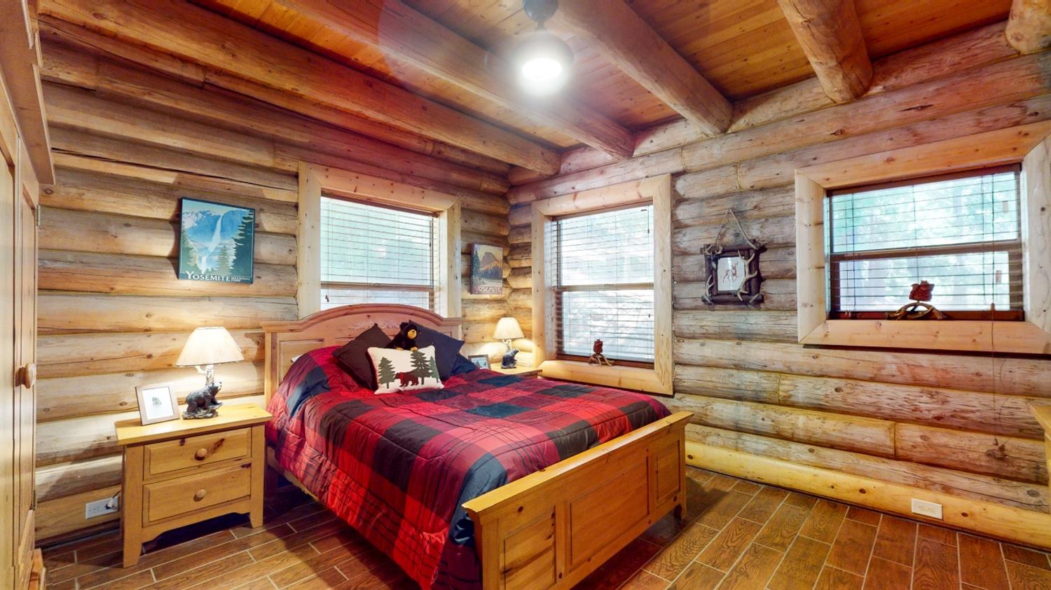 10671 Lowell Hill Road Nevada City, CA 95959 - Photo 7 of 35 a bed room with a bed and a large window