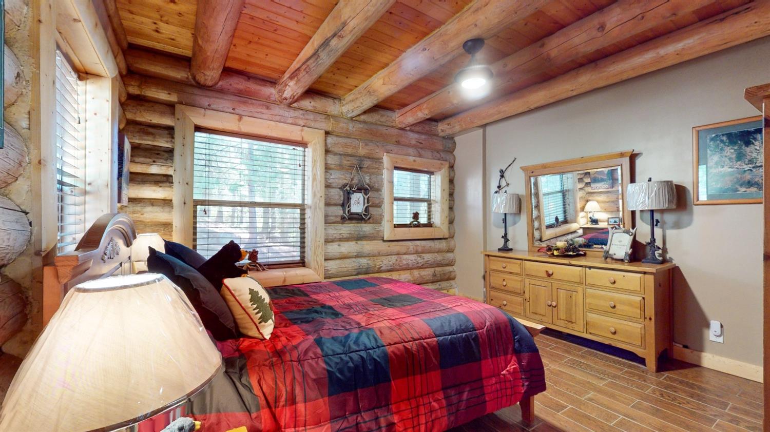 10671 Lowell Hill Road Nevada City, CA 95959 - Photo 8 of 35 a bedroom with a bed and wooden floor