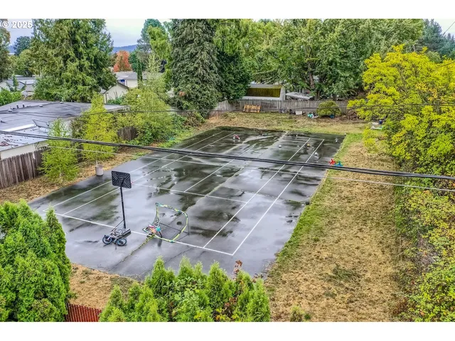 a aerial view of a house with a yard
