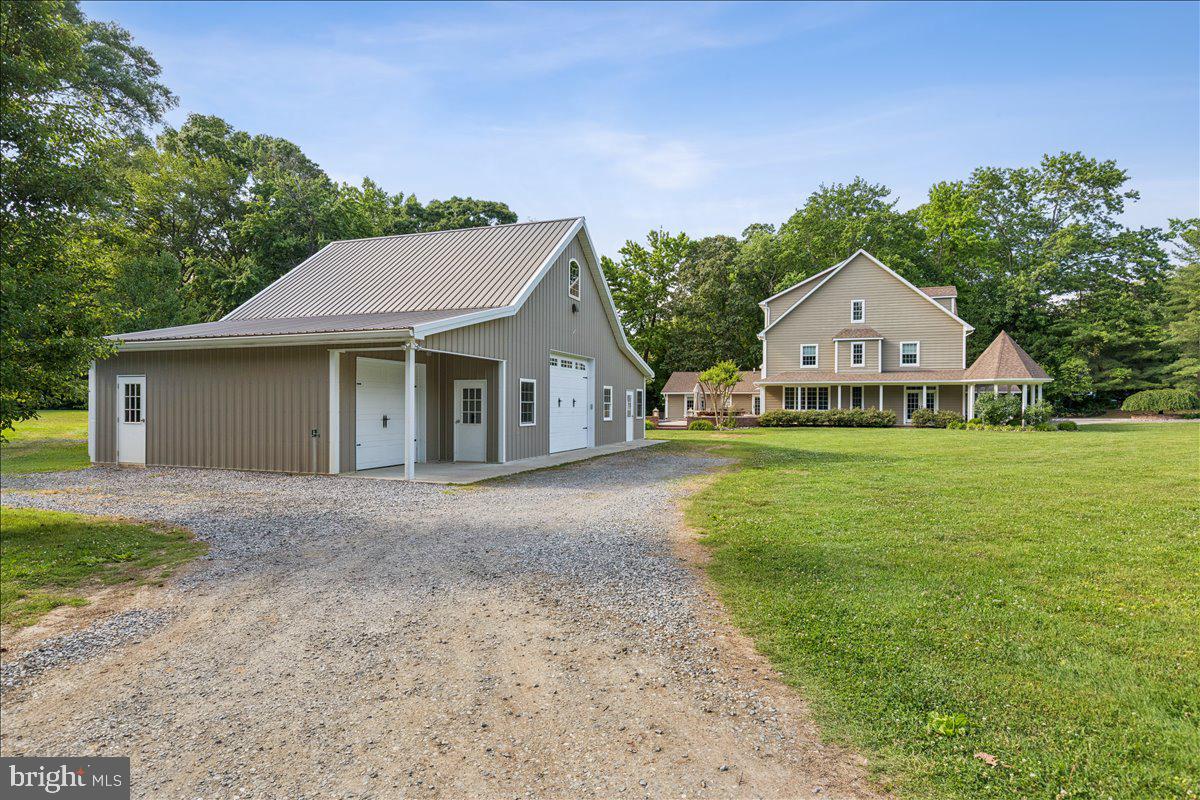 102 Little Neck Road Stevensville, MD 21666 - Photo 63 of 77 a front view of house with yard and green space