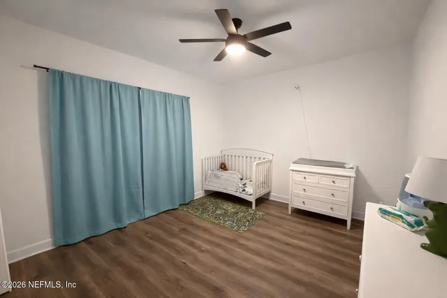 a bed room with furniture and a window