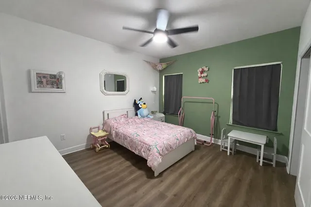 a bedroom with a bed and a table in it