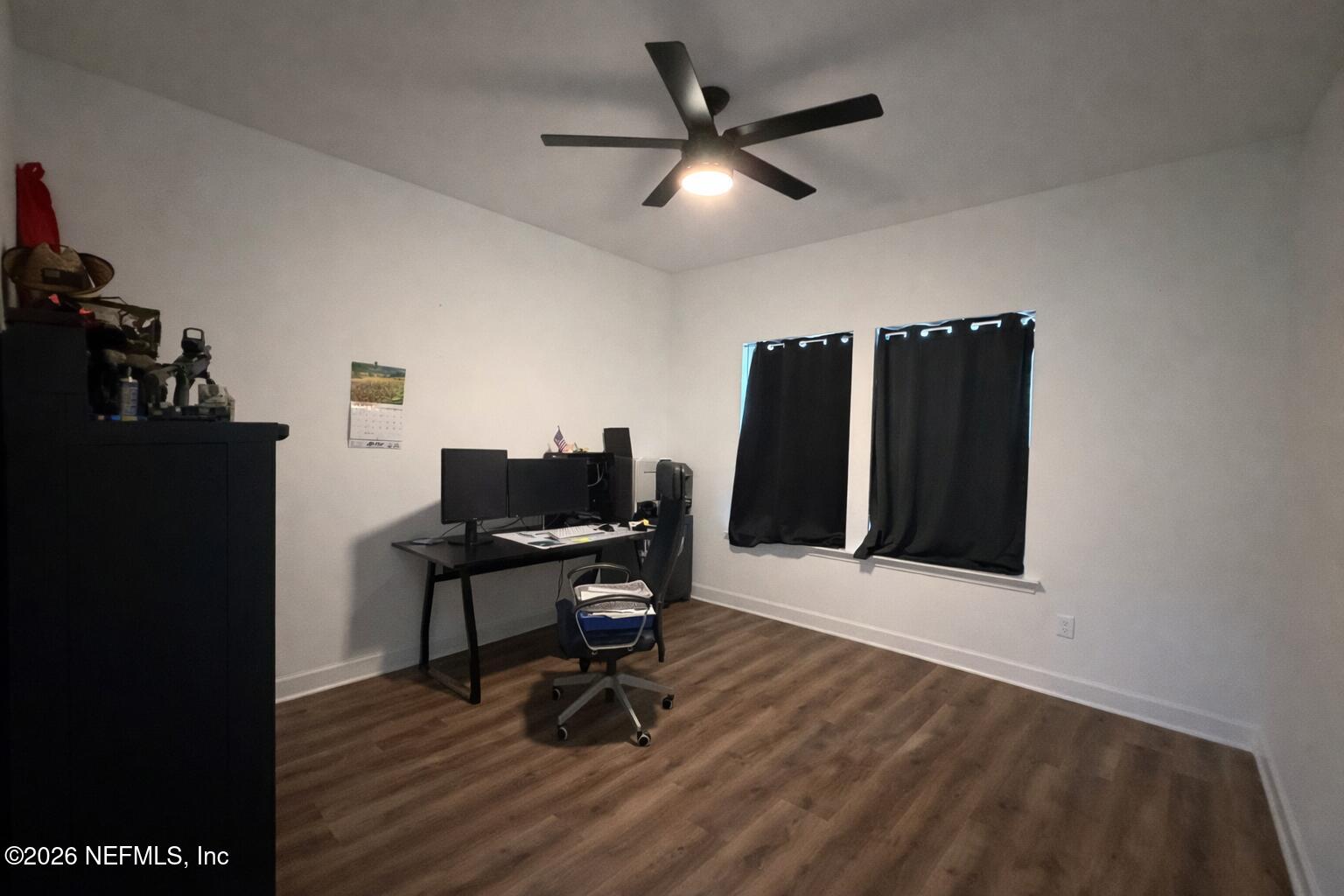 5012 Laurel Street Middleburg, FL 32068 - Photo 16 of 33 a view of a workspace with furniture and wooden floor