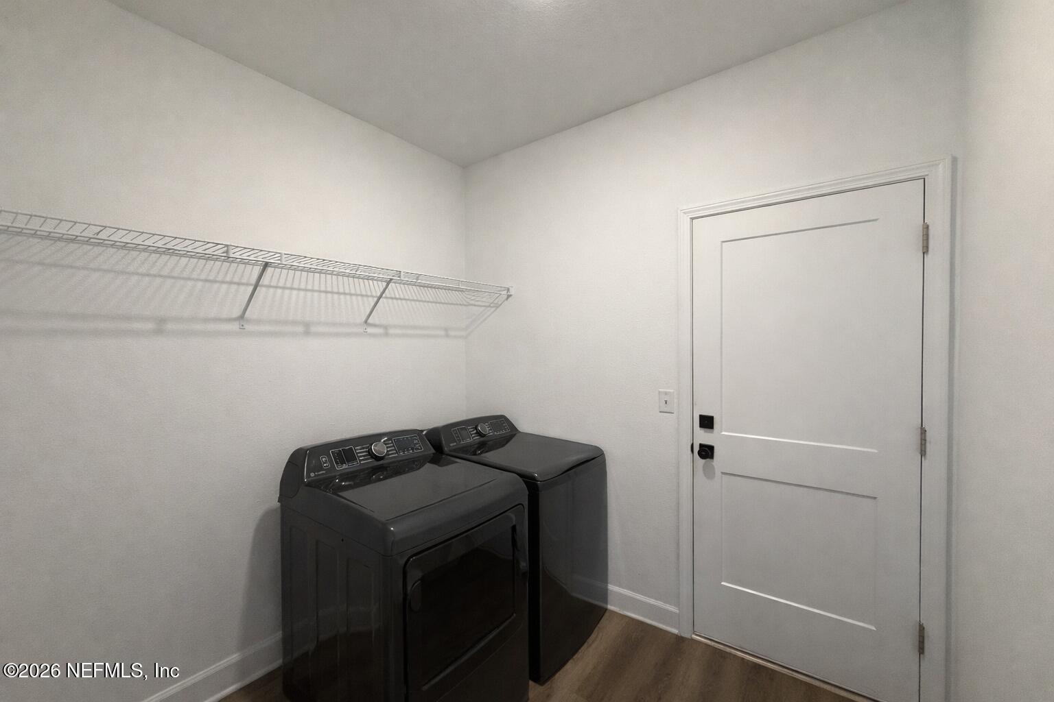 5012 Laurel Street Middleburg, FL 32068 - Photo 17 of 33 a view of storage and utility room with racks on the wall