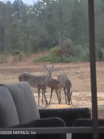 a view of balcony with furniture