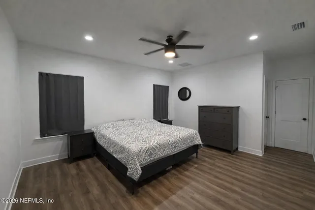 a bedroom with a bed and a dresser