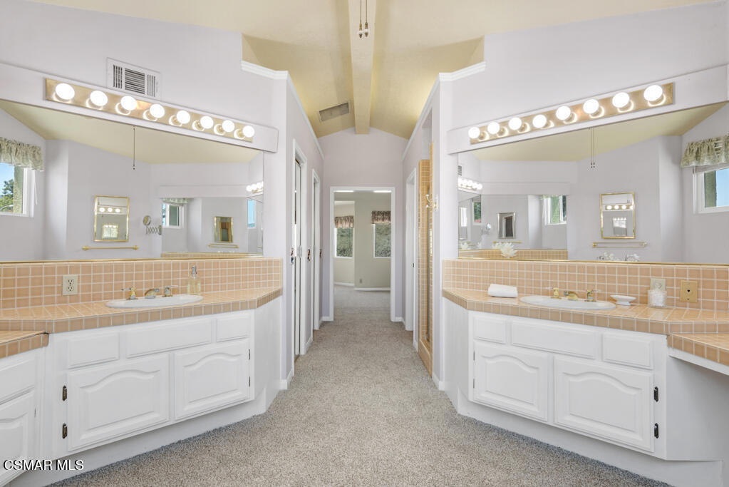 5339 Seneca Place Simi Valley, CA 93063 - Photo 47 of 76 a spacious bathroom with a granite countertop sink a mirror and a