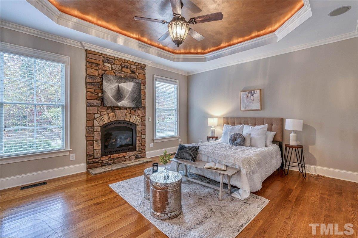 3220 Mossy Ridge Court Raleigh, NC 27613 - Photo 8 of 30 a bedroom with furniture and a fireplace