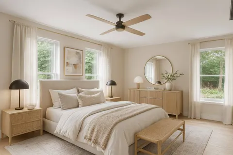 a bedroom with a large bed and a large window