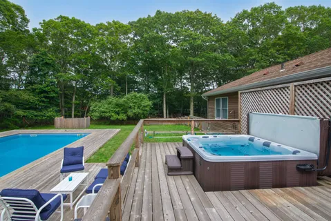 a view of swimming pool with lounge chair