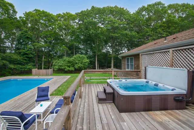 a view of swimming pool with lounge chair