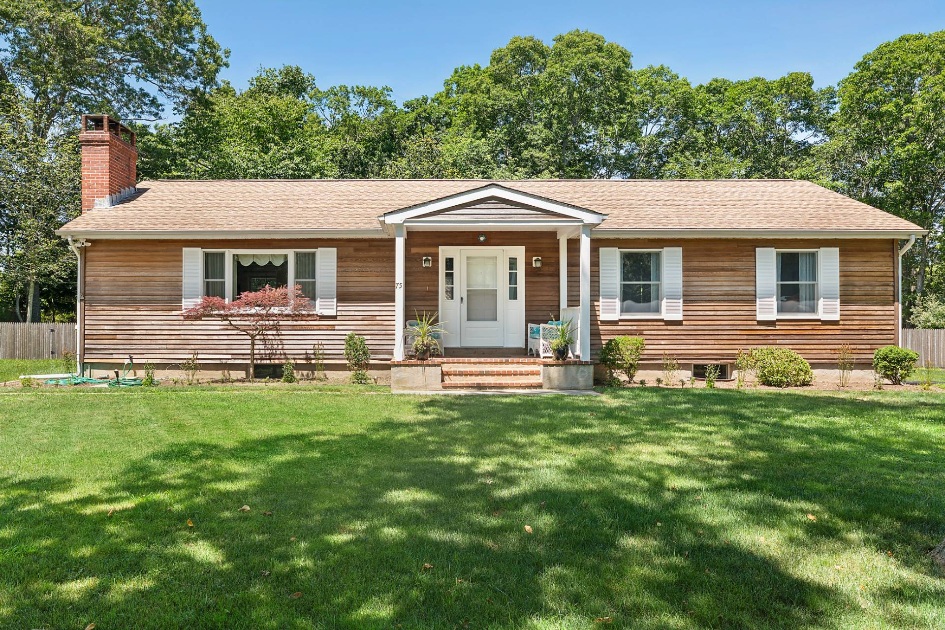 75 Edwards Avenue East Hampton, NY 11937 - Photo 26 of 27 a front view of house with yard and green space