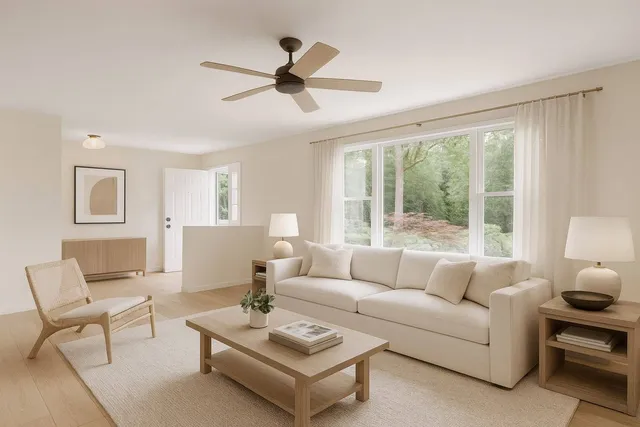 a living room with furniture and a large window