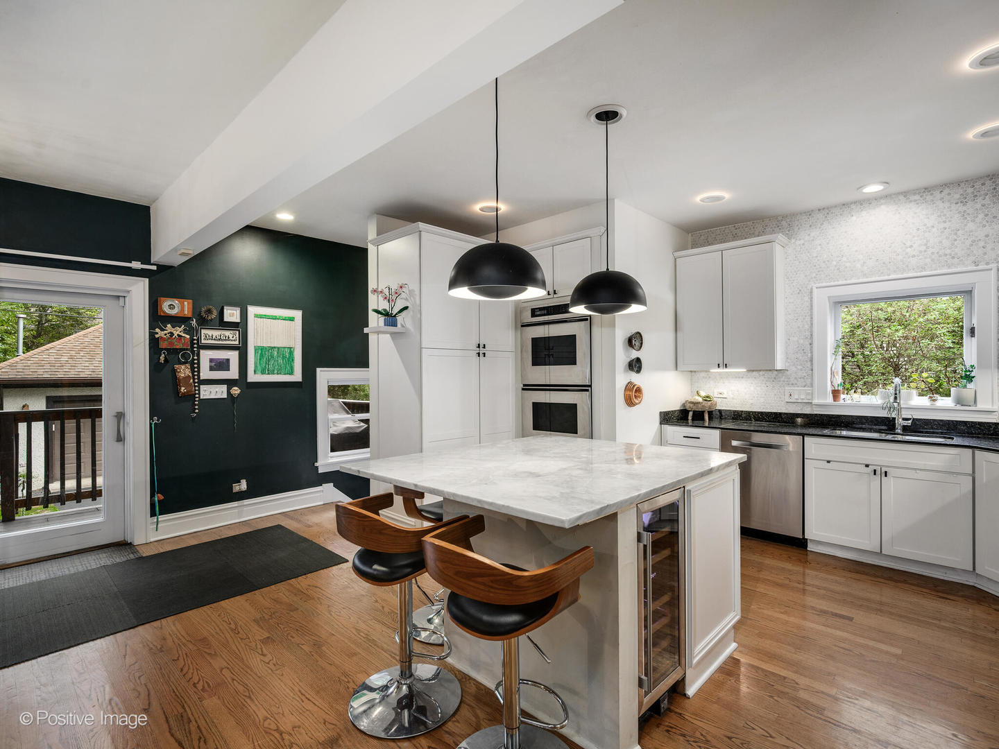 225 Clinton Avenue Oak Park, IL 60302 - Photo 11 of 37 a kitchen with stainless steel appliances granite countertop a stove a sink a oven a dining table and chairs