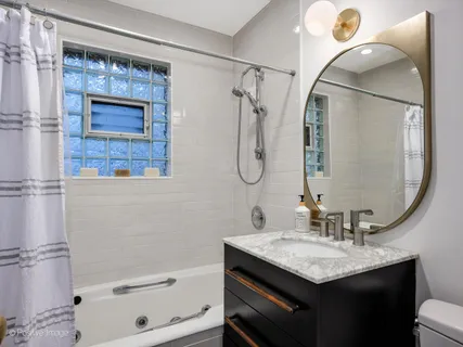 a dining room with furniture entryway and wooden floor