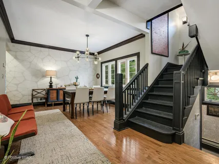 a spacious bedroom with a bed and a chandelier