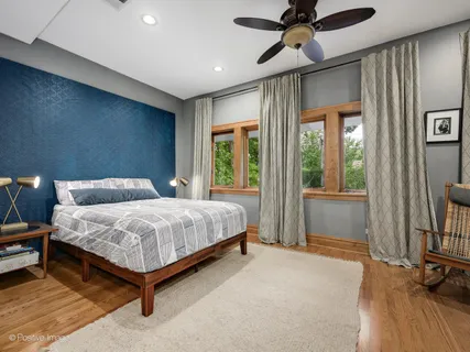 a bedroom with a bed and a television