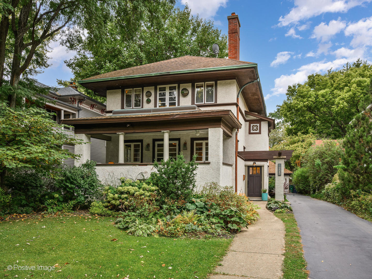 225 Clinton Avenue Oak Park, IL 60302 - Photo 2 of 37 a front view of a house with a garden