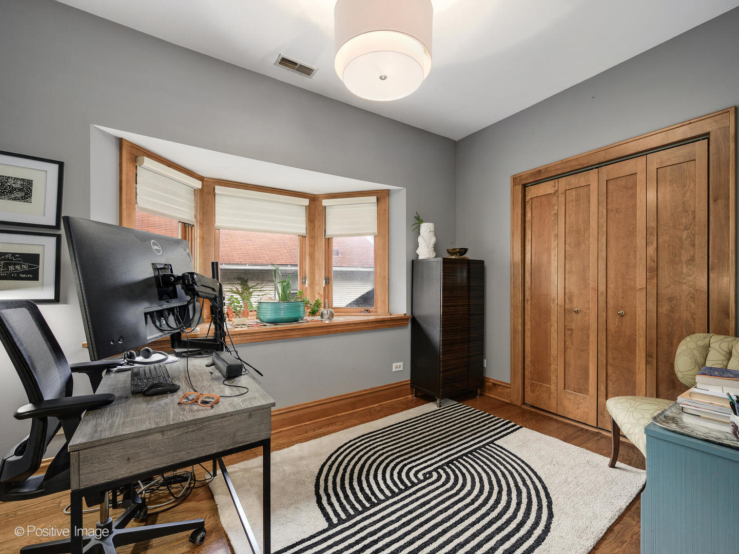 225 Clinton Avenue Oak Park, IL 60302 - Photo 29 of 37 a bedroom with a bed and a window