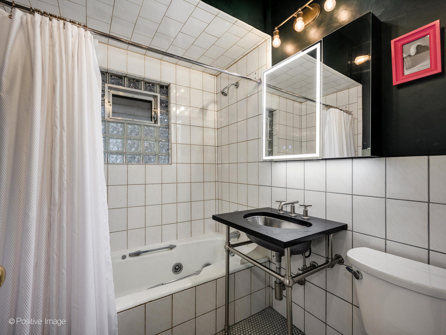 225 Clinton Avenue Oak Park, IL 60302 - Photo 30 of 37 a bathroom with a shower and a sink