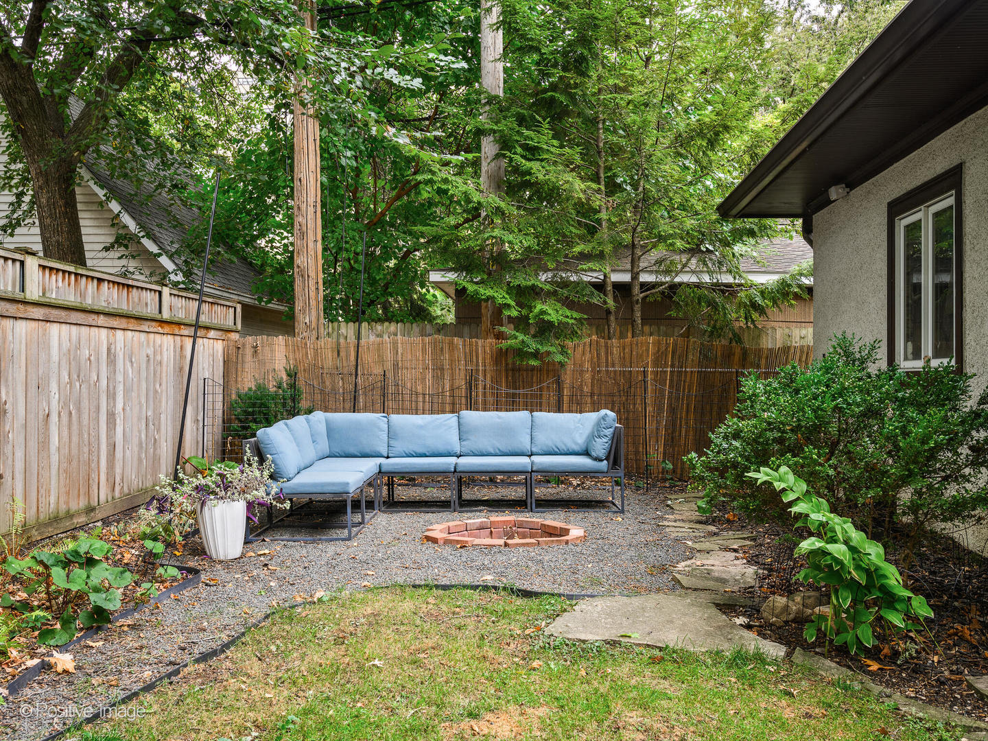 225 Clinton Avenue Oak Park, IL 60302 - Photo 33 of 37 a view of a backyard with a bench and potted plants